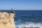 Malta Gozo, Young man watching the ocean on a bright day at Gharb, Malta Gozo