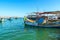 Malta, Marsaxlokk, August 2019.  A brightly colored fishing boat in the bay.