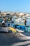 Malta, Marsaxlokk, August 2019. Local fishermen on the embankment near their boats.