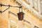 Malta, Mdina. Old lantern lamp in the medieval city with the narrow streets and houses limestone facades