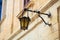 Malta, Mdina. Old lantern lamp in the medieval city with the narrow streets and houses limestone facades