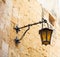 Malta, Mdina. Old lantern lamp in the medieval city with the narrow streets and houses limestone facades