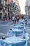 Malta, Valletta, August 2019. Tables of a street cafe laid in anticipation of guests.