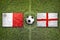 Malta vs. England flags on soccer field