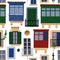 Maltese balconies and windows with various decorations and colors over the stone brick walls