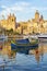 Maltese boat luzzu moored in the harbor in Dockyard creek. Bir