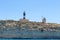 Maltese bunkers with lighthouse at Malta