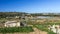 Maltese countryside in sunny winter day with vegetable greenhouses and arable land for growing crops