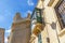 Maltese streets and colourful wooden balconies in Valletta, Malta