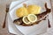 Mamaliga and whole grilled fish with lemon slices