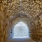 Mamluk era arched stones tunnel leading to Al-Muayyad Bimaristan ancient hospital, Cairo, Egypt