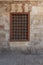 Mamluk era wooden closed window with wooden ornate grid over stone bricks wall, Blue Mosque, Cairo, Egypt