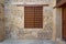 Mamluk era wooden closed window with wooden ornate grid over stone bricks wall, Medieval Cairo, Egypt