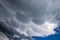 Mammatus clouds on the underside of a thunderstorm anvil cloud.