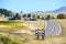 Mammoth Hot Springs, elevation 6329 road sign. Background cars driving on scenic highway 89. Parking lotÑŽ