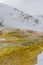 Mammoth hot springs terraces in the wintertime at Yellowstone National Park - beautiful steaming colorful travertine limestone ter