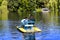 A man with 2 children, Hasidic Jews, ride a catamaran on a lake in the autumn Sofia park in Uman, Ukraine