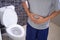 Man abdominal pain and constipation in the bathroom. Concept of health problems, stomach, diarrhea