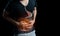Man abdominal pain, photo of large intestine on body, stomachache diarrhea symptom, menstrual period cramp or food poisoning.