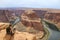 A man above Horseshoe Bend, Colorado river, Arizona