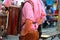 Man with an accordion, red checkered shirt and bavarian leather