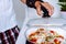 Man with adjustable elbow brace preparing food