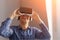 Man adjusting VR goggles
