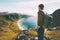 Man admires ocean beach aerial view solo traveling