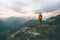 Man adventurer on mountain summit hiking