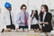 A man African American engineering and caucasian standing and brainstorm together. In group meetings Viewing a model building