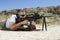 Man Aiming Machine Gun At Firing Range