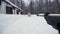 A man aiming a pellet gun towards a target, practicing his aim in the winter. Clip. The shooter in camouflage targets a