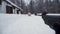 A man aiming a pellet gun towards a target, practicing his aim in the winter. Clip. The shooter in camouflage targets a