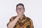 A man alarmed and in disbelief after seeing something shocking or controversial and provocative news. Wearing a batik shirt and