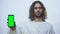 Man alike Jesus holding pre keyed smartphone, mobile bible application, online