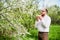 Man allergic suffering from seasonal allergy at spring, sneezing and blowing nose with handkerchief.