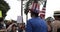 Man with an American flag hat at protest against vaccine mandates