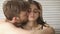 Man apologizing for mistake, kissing embracing offended resentful woman, closeup