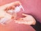 man Applying an antibacterial antiseptic hand gel to kid