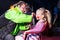 Man Applying Clown Make Up to Girls Face