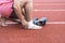 Man applying compression bandage onto ankle injury After exercise