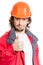 Man architector or builder showing thumb up over white background