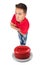 Man with arms crossed on top of a red button