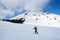 Man ascending during ski touring in the spectacularly white mountains