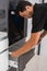 Man assembling a drawer in a kitchen cabinet