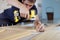 Man assembling furniture at home using a cordless screwdriver