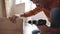 A man assembling furniture in the house