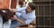 Man assembling parts of table on moving day, vertical view