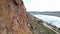 Man athlete climbing on the high rock