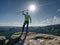 Man athlete runner with trekking poles running rocky trail